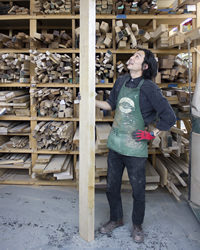 Peter Suzuki Looks Up a Plank of Lumber
