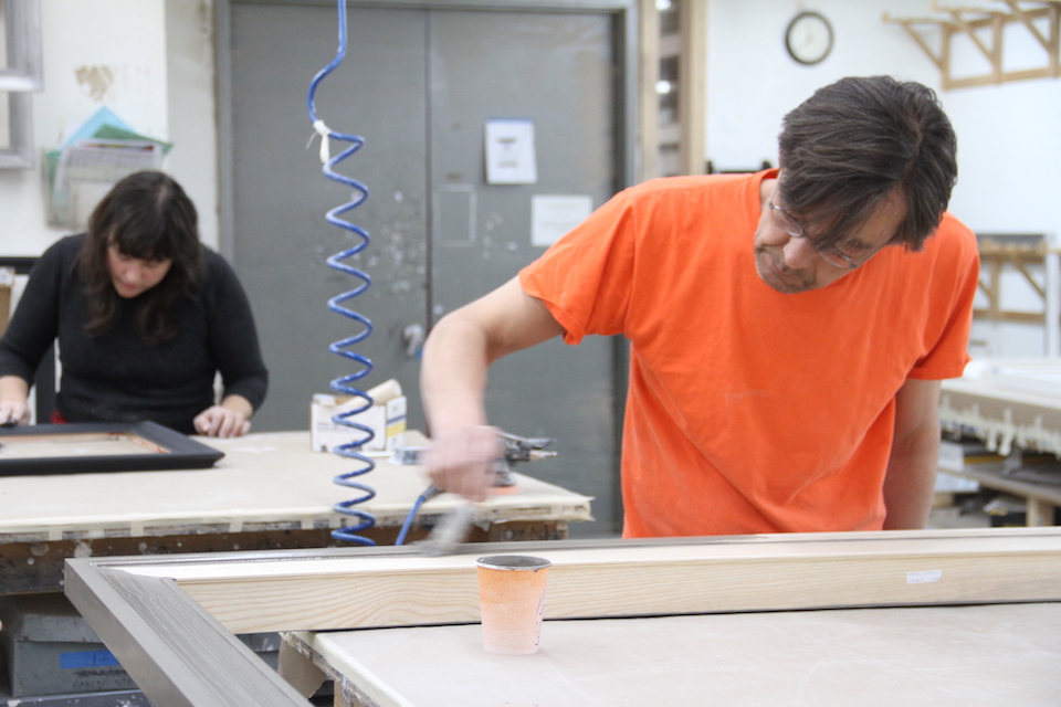 Staff at Work Painting Frames