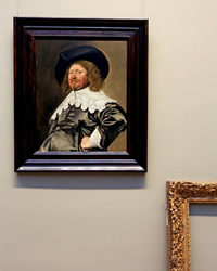 Frans Hal Portrait in New Frame with Empty Old Frame Against Wall