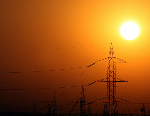 Sun Rising Over Power Lines