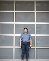 Camila in front of Bark Frameworks building