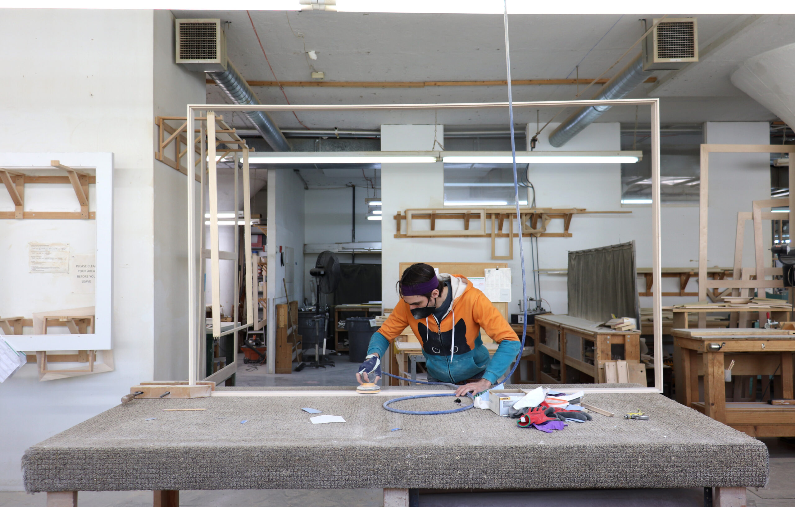 ethan sanding a large frame